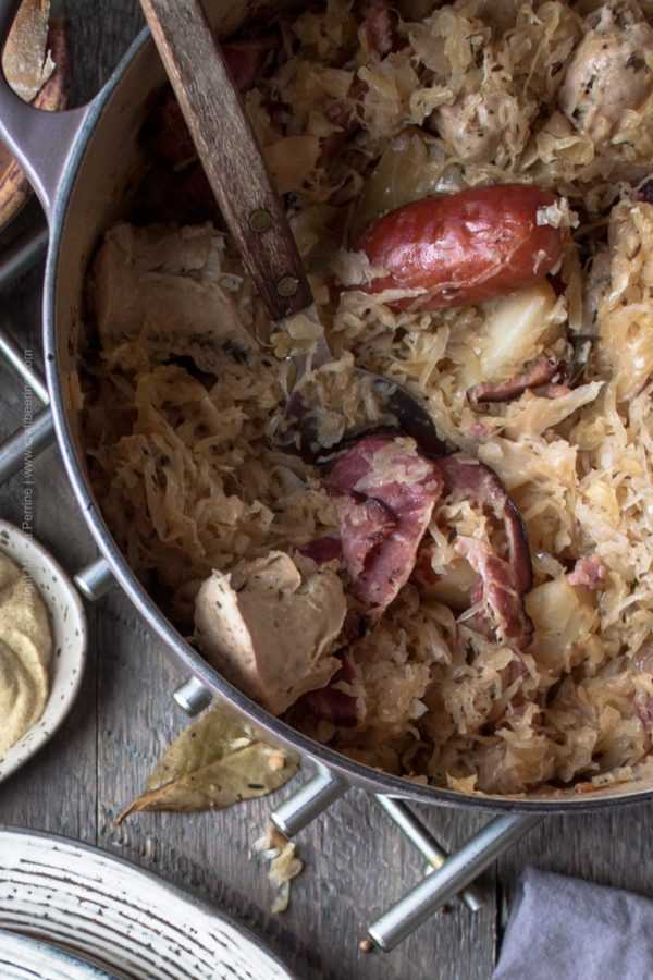 Choucroute garnie, baked with spices and smoked charcuterie #choucroute #choucroutegarnie #choucrouterecipe #sauerkraut #cookingwithbeer