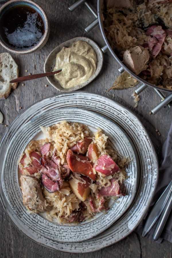 Alsatian baked sauerkraut with meat, aka Choucroute Garnie. #cookingwithbeer #choucroute #choucroutegarnie #choucroutegarnierecipe #choucrouterecipe