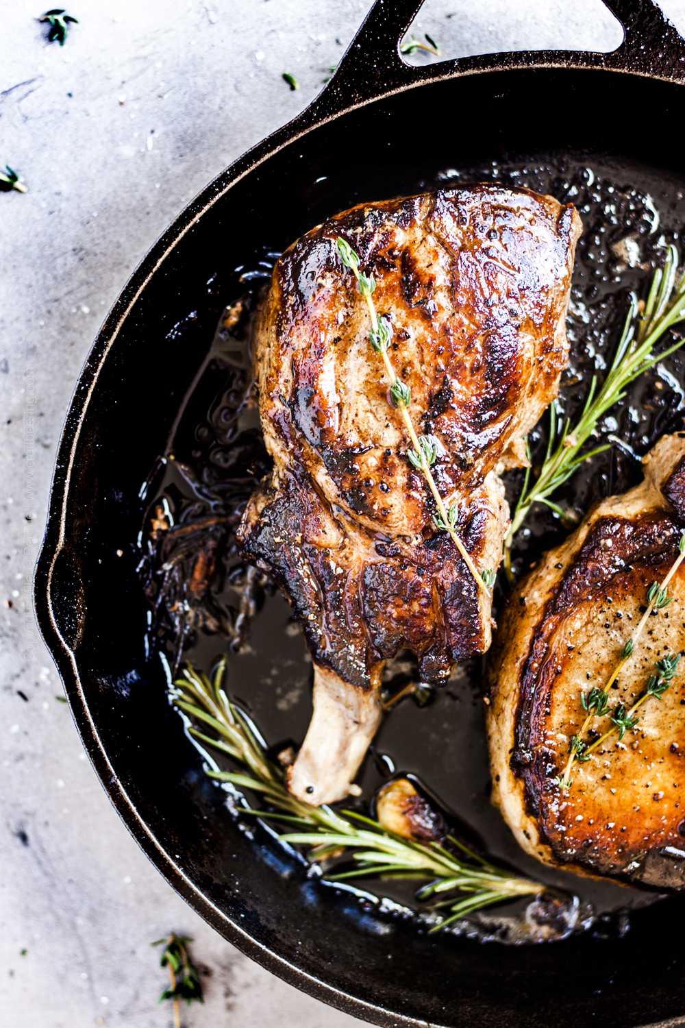 Pan seared pork chops in cast iron skillet