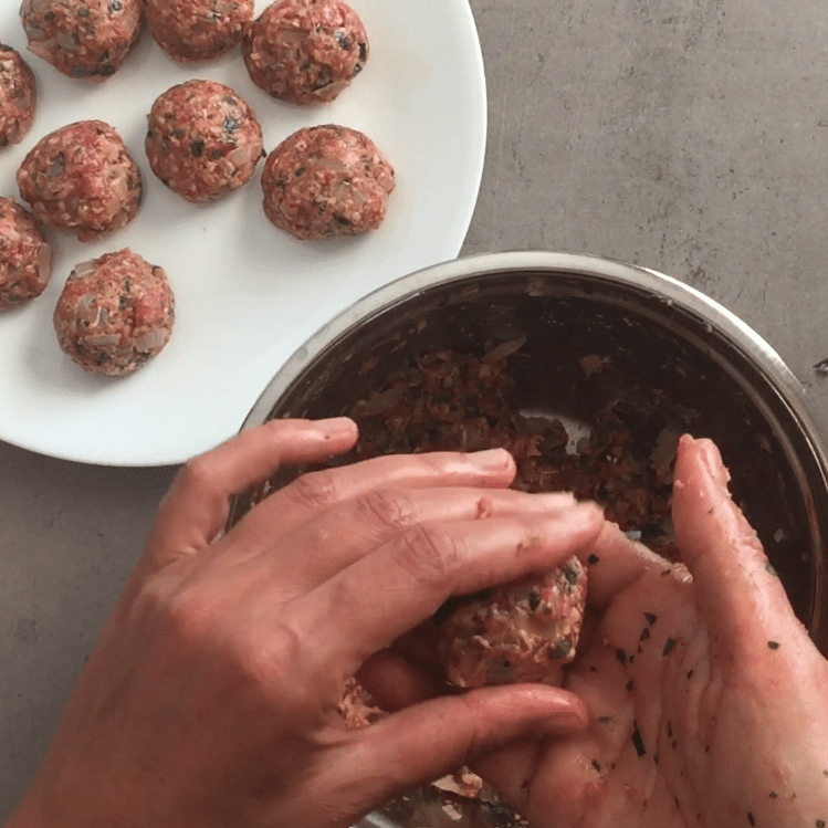 Frikadellen shape mixture into patties or meatballs