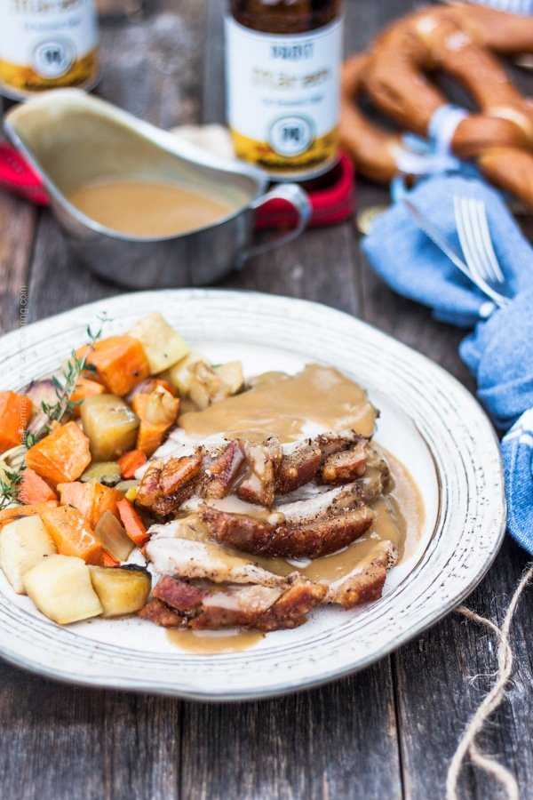 Bavarian feast perfection - sliced boneless pork shoulder roast with beer and pan drippings gravy
