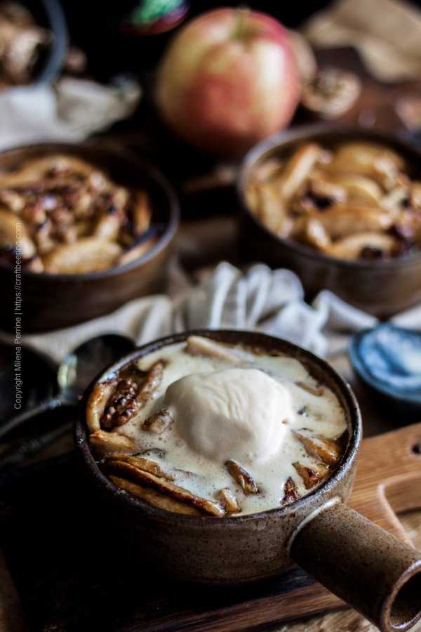 Slice baked apples in individual baking dish topped with vanilla ice cream.