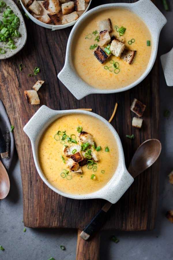 Beer Cheese Soup served with croutons an garnished with green onions. 