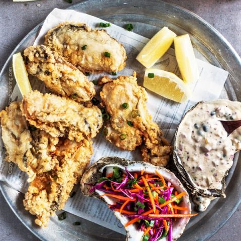 Panko breaded pan fried oysters served wit remoulade and coleslaw.