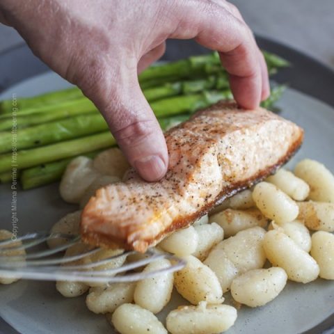 Use spatula to serve the pan seared salmon