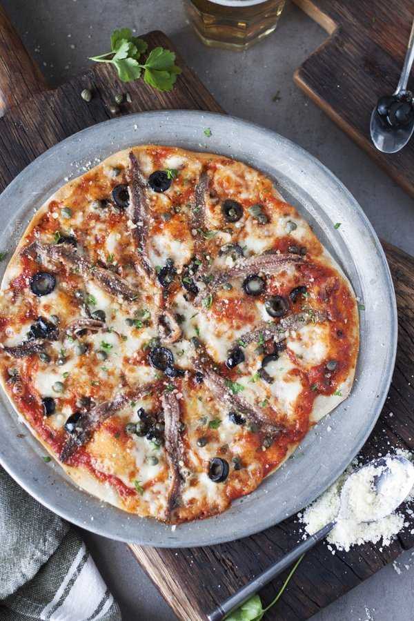 Anchovies pizza with capers and olives