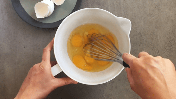 Beat eggs for the custard.