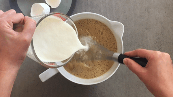 Add the heavy cream and whisk to finish the custard.