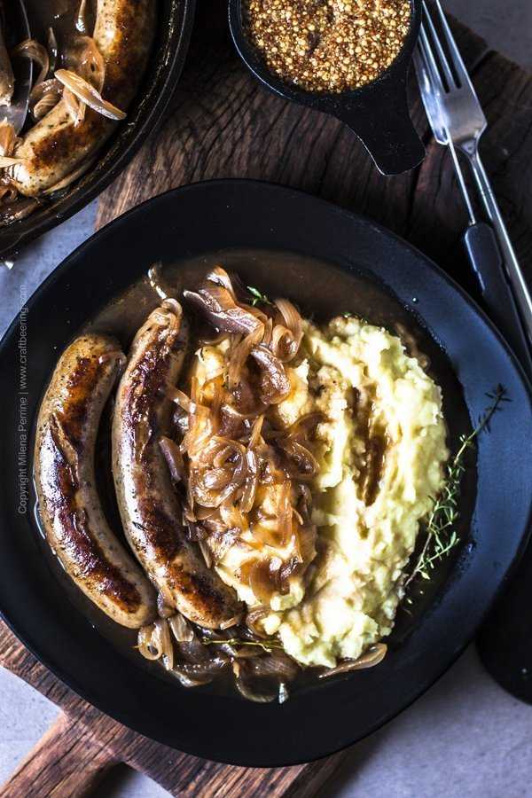 Beer brats served with mashed potatoes.