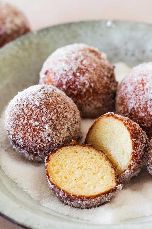 German quark donut holes rolled in vanilla sugar as soon as they are fried. 