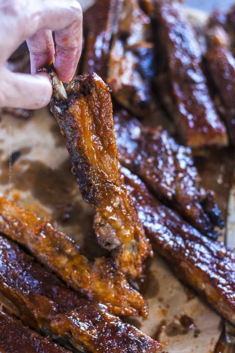 Tender oven baked spare ribs smothered with BBQ sauce