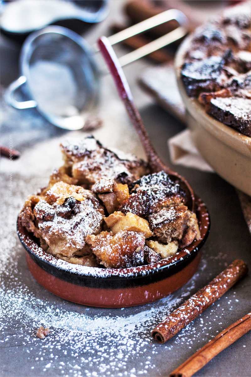 Individual serving of apple bread pudding.