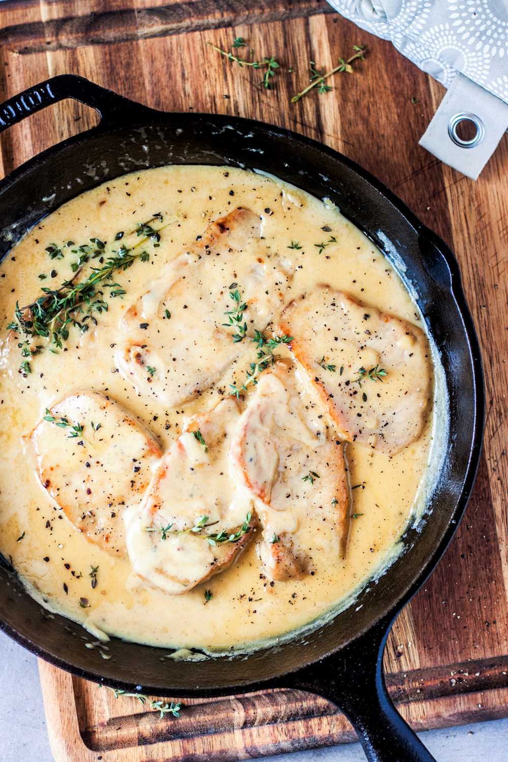 Stove top thin pork chops with creamy sauce, one of the best pork cutlet recipes