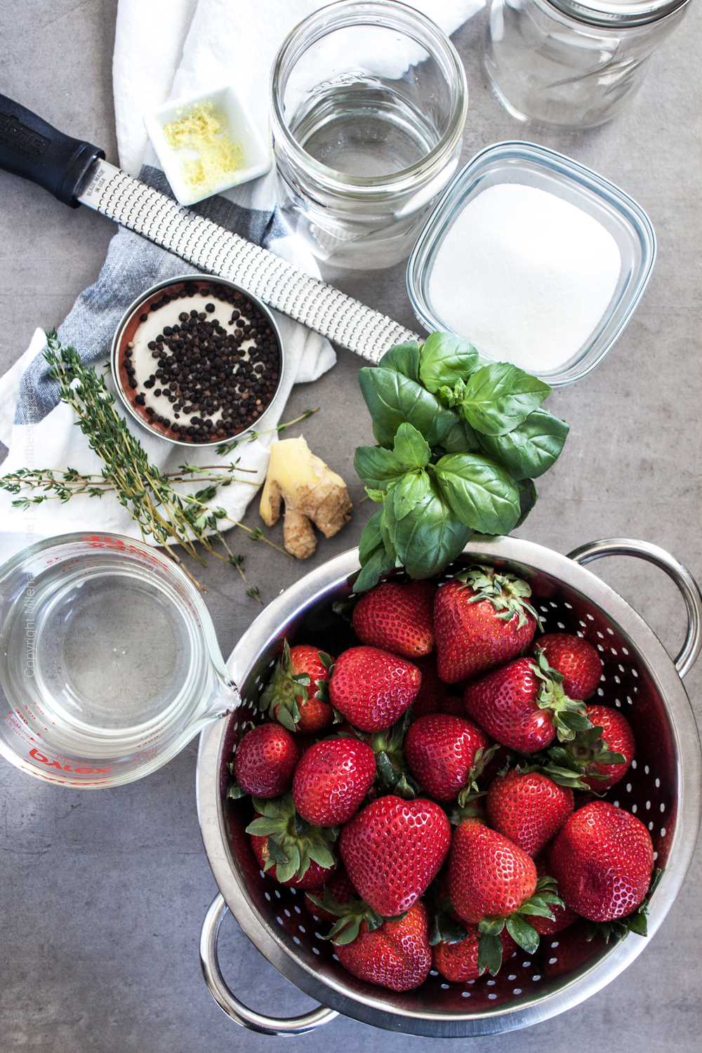 Fresh strawberries, thyme, basil, peppercorns, vinegar, water and sugar. 