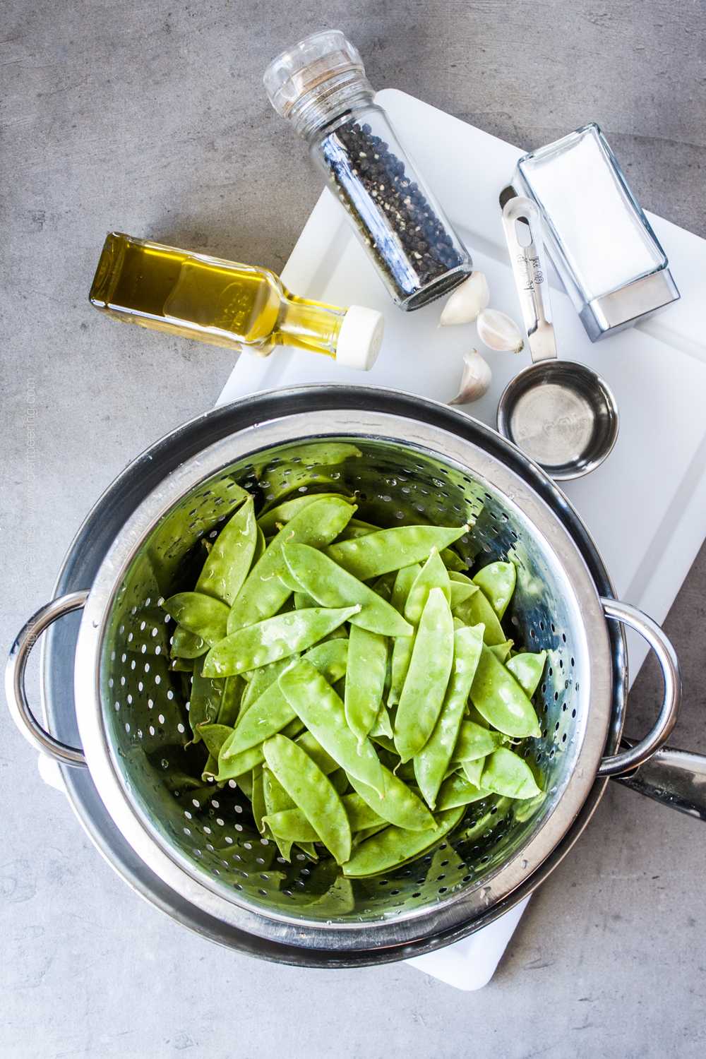 Ingredients for snow peas recipe in skillet