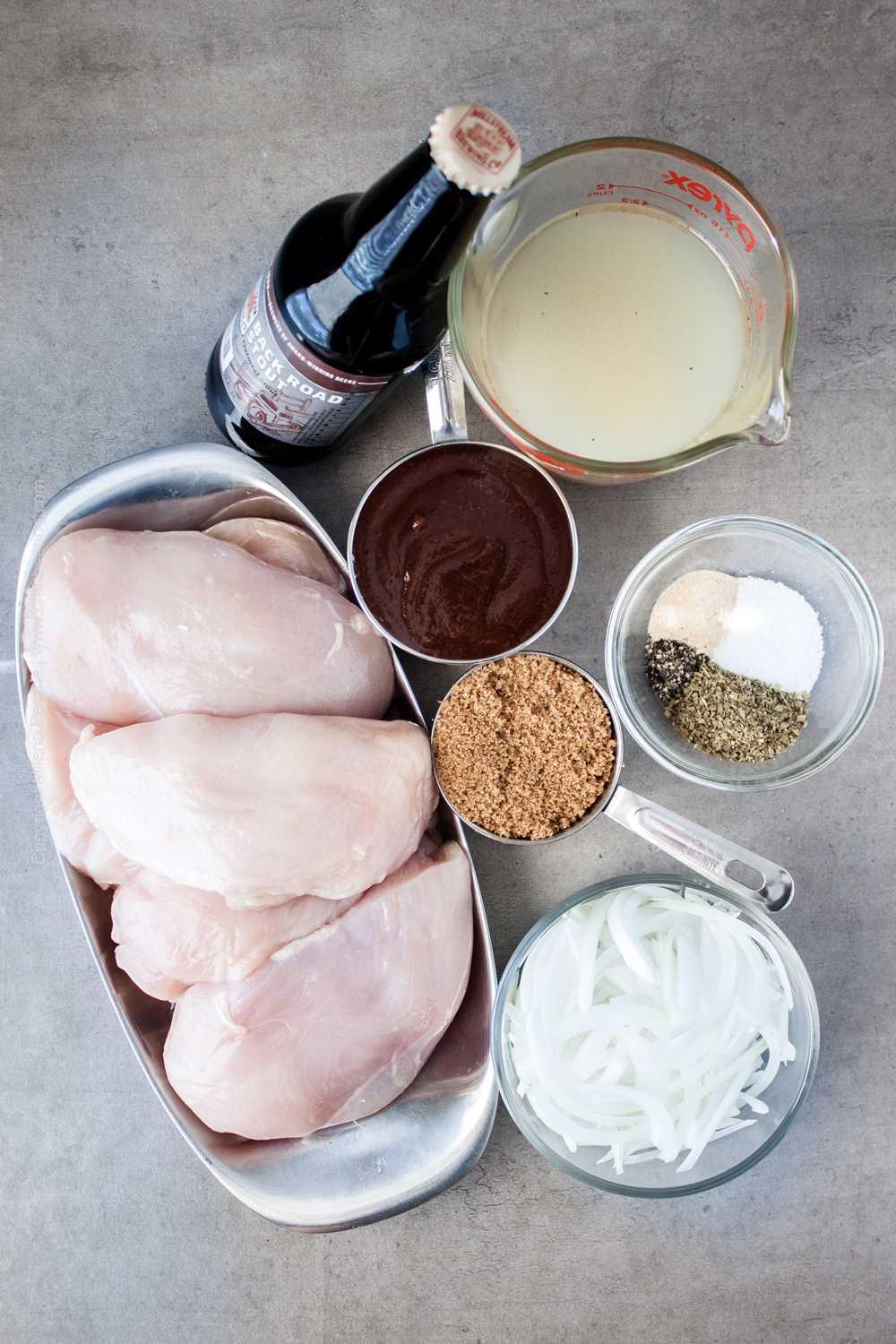 Ingredients for pulled chicken crock pot - Chicken breast, beer, barbecue sauce, brown sugar, onions, chicken stock and and seasonings