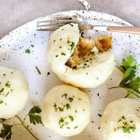 Potato dumplings with bread crouton and butter filling - German style.