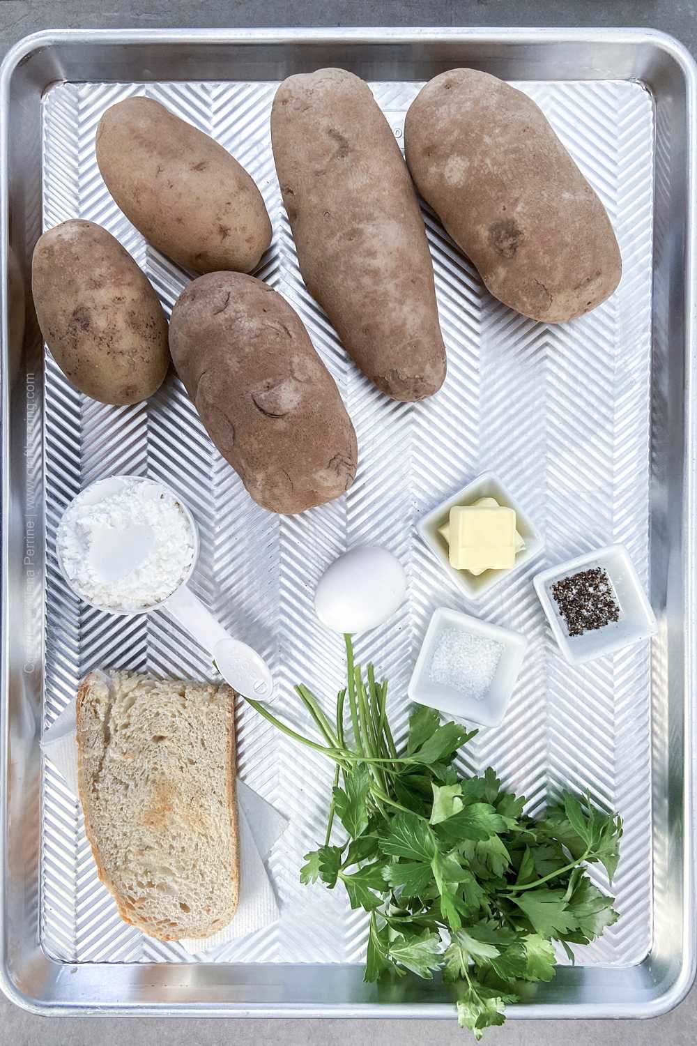 Ingredients for German potato dumplings - starchy potatoes, egg, corn starch or flour,, salt and pepper