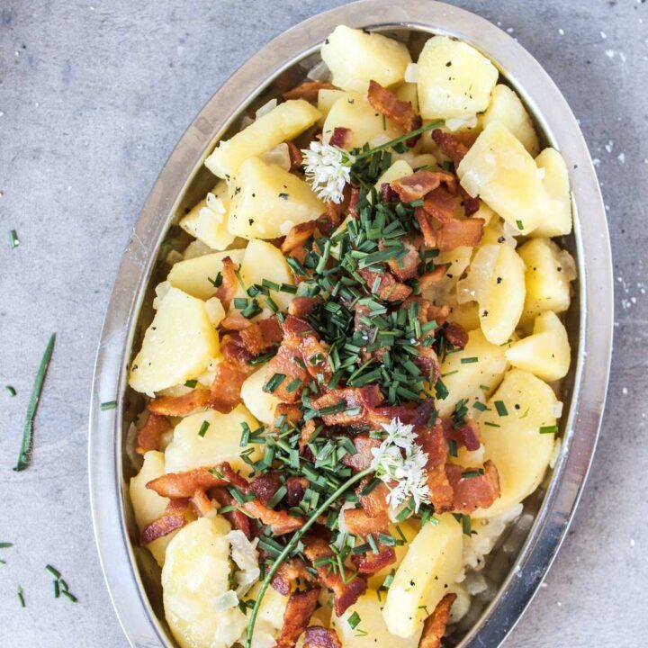 Warm Bavarian potato salad with bacon and garlic chives.
