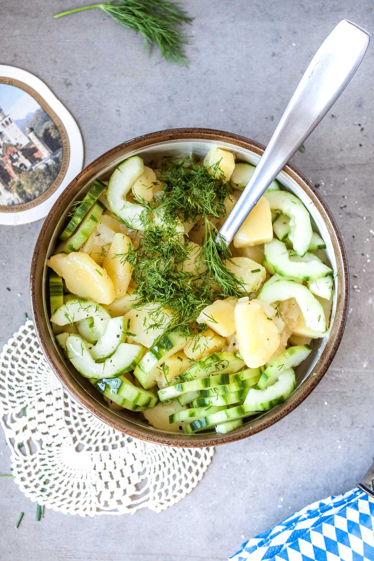 Cold Kartoffelsalat with cucumber sliced and chopped fresh dill. 