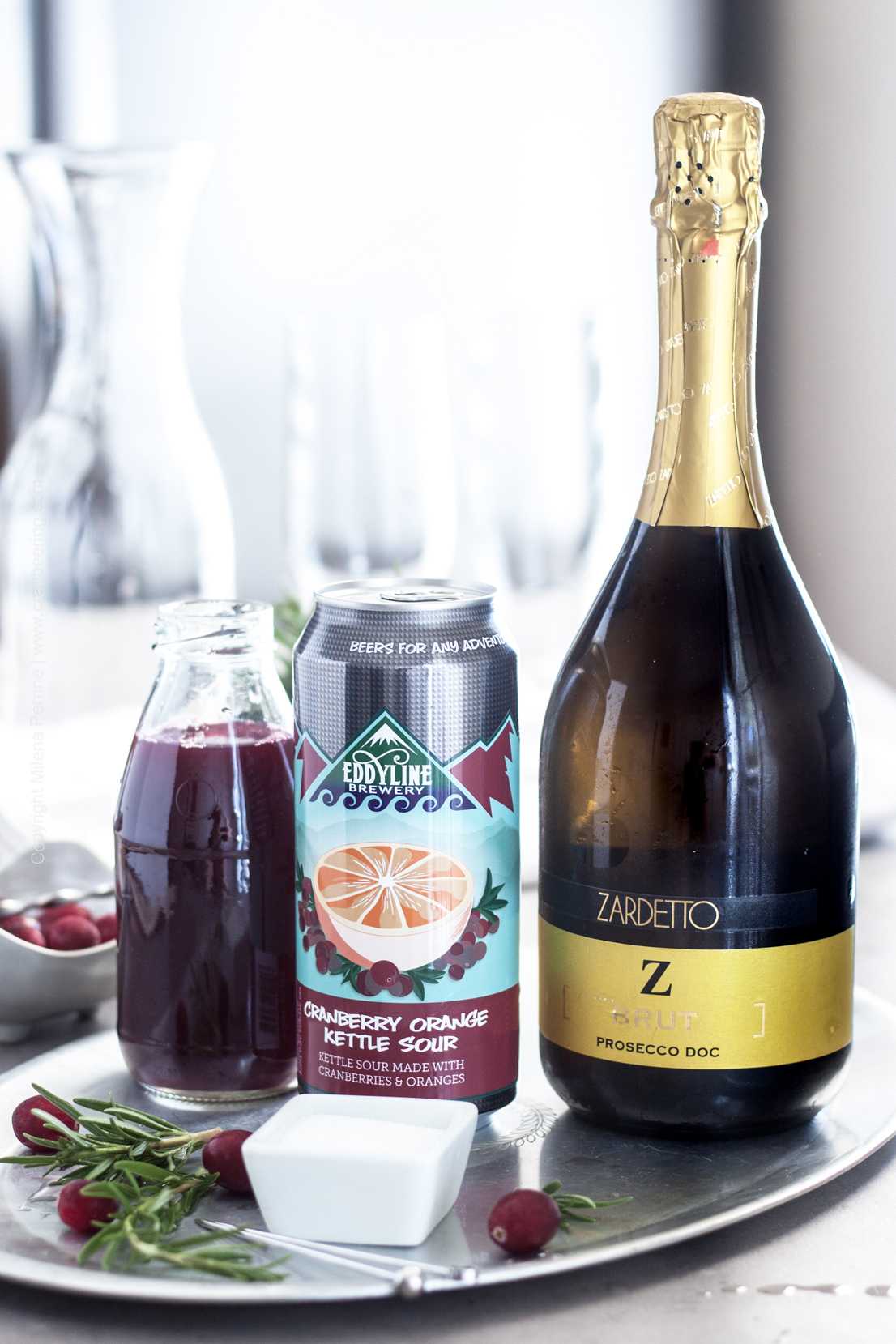 Ingredients for a prosecco cocktail with cranberry