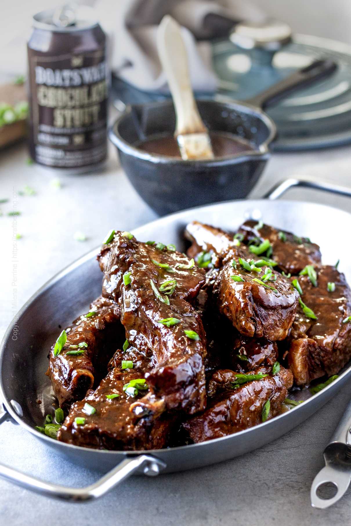 Pork country style ribs braised with stout and soy sauce, smothered in sauce.