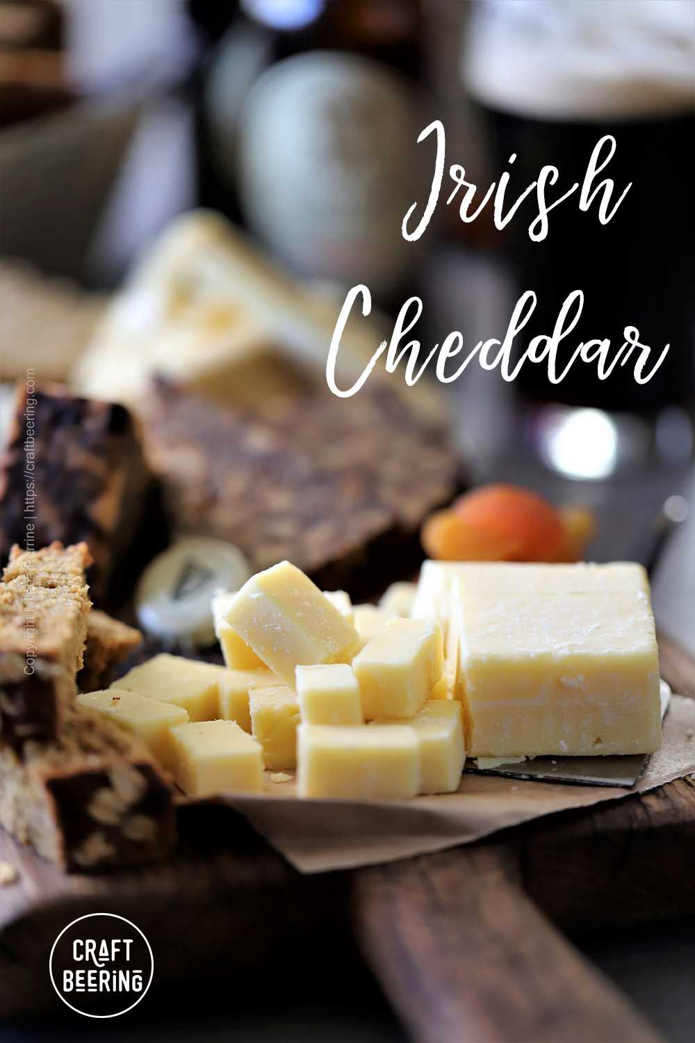 Aged Irish cheddar cut into cubes as part of a cheeseboard. 