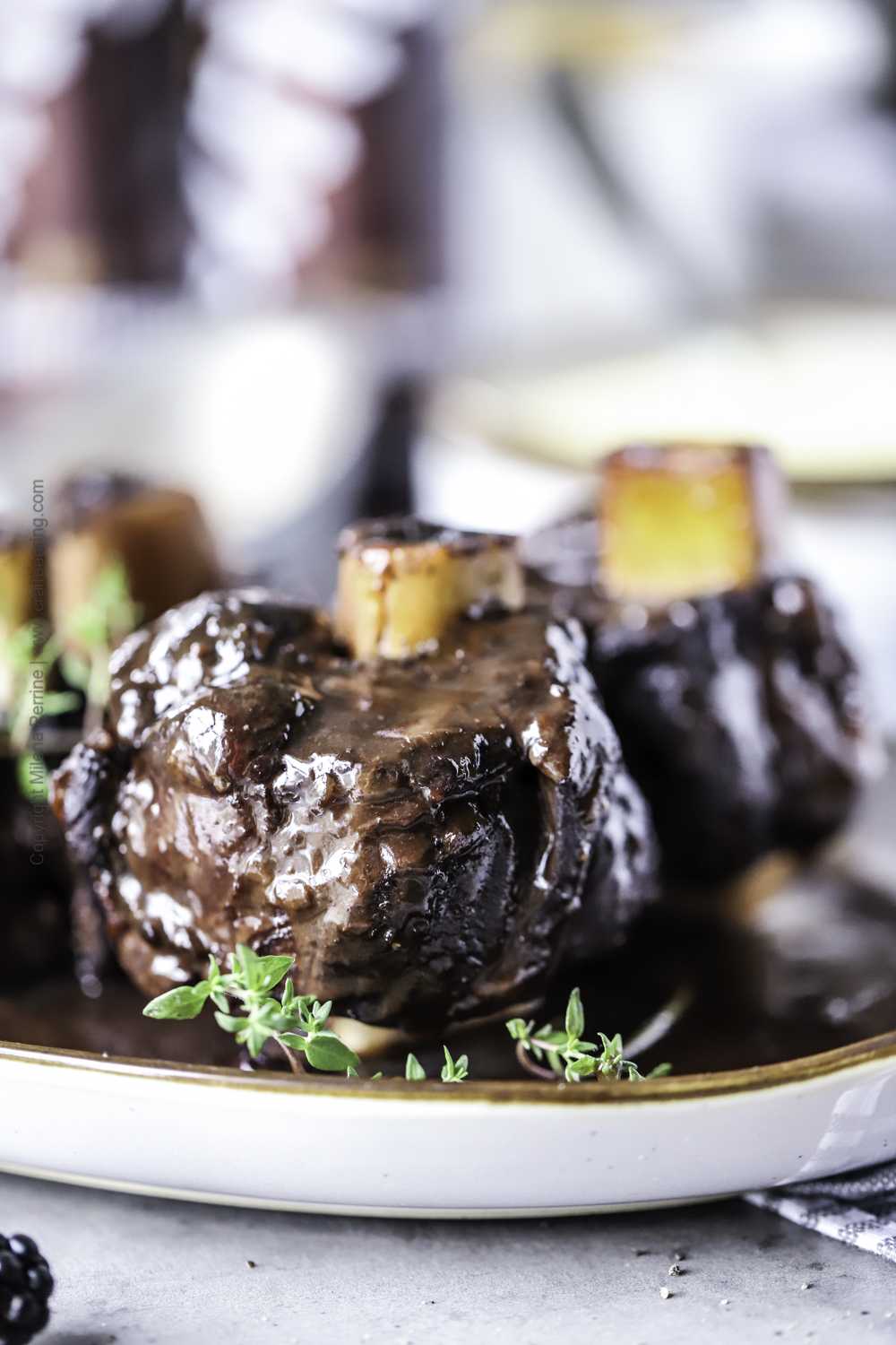 Braised venison shanks (osso buco cut) with rich blackberry and German black lager sauce.