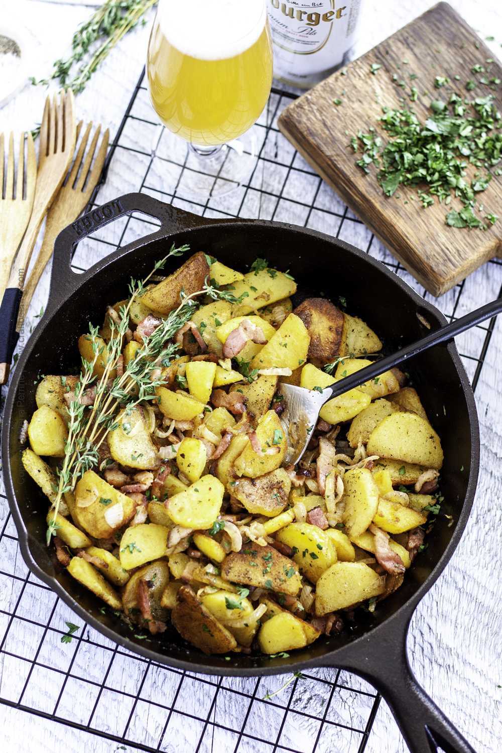 German fried potatoes with bacon in skillet