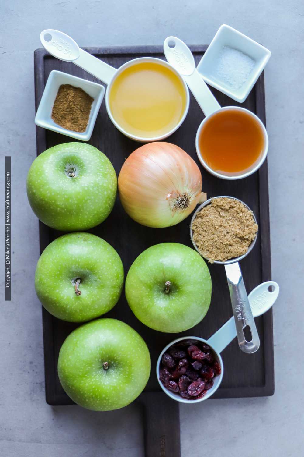 Green apples and other ingredients for apple chutney with cranberries