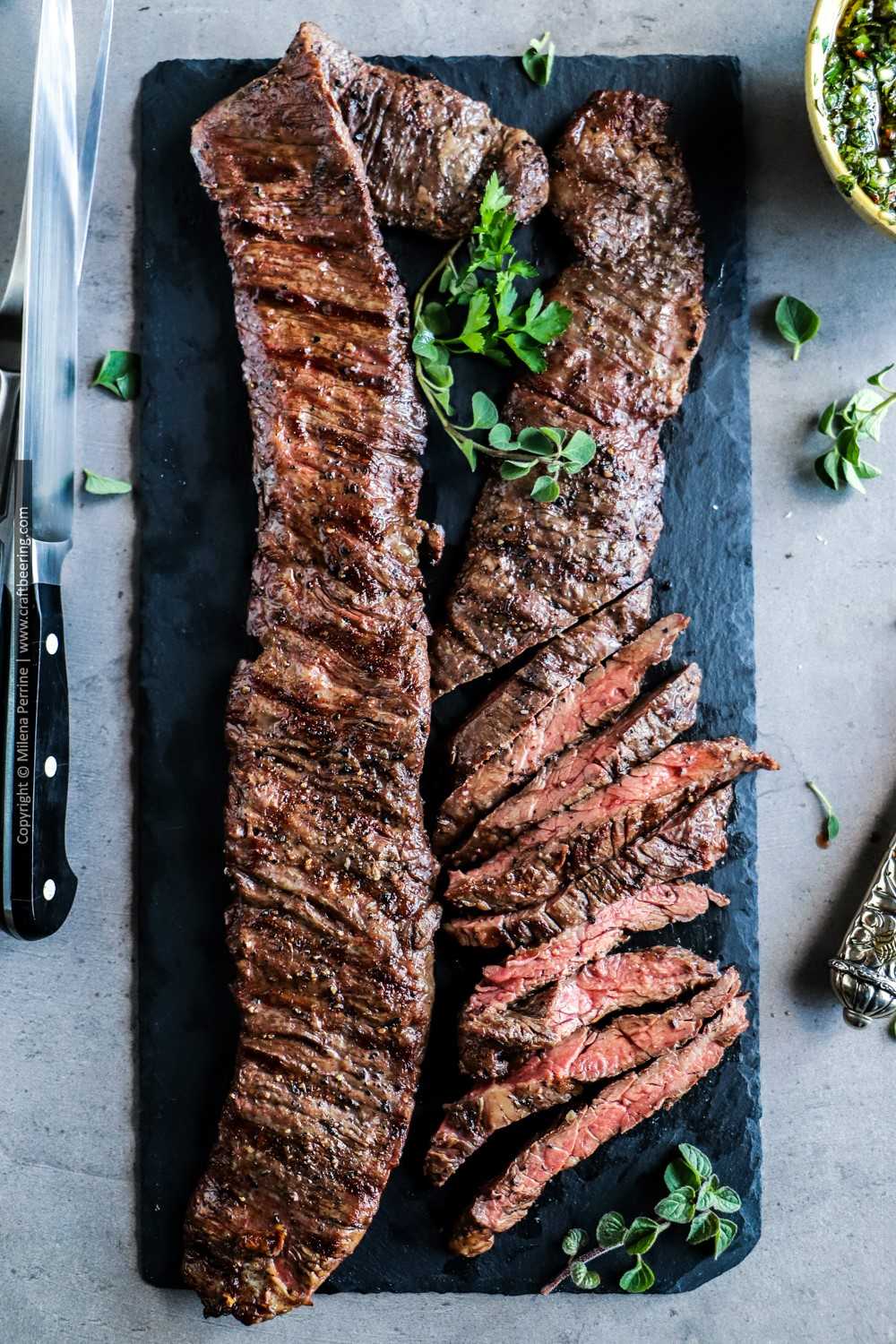 Grilled outside skirt steak with chimichurri in the style of Argentinian entrana a la parilla
