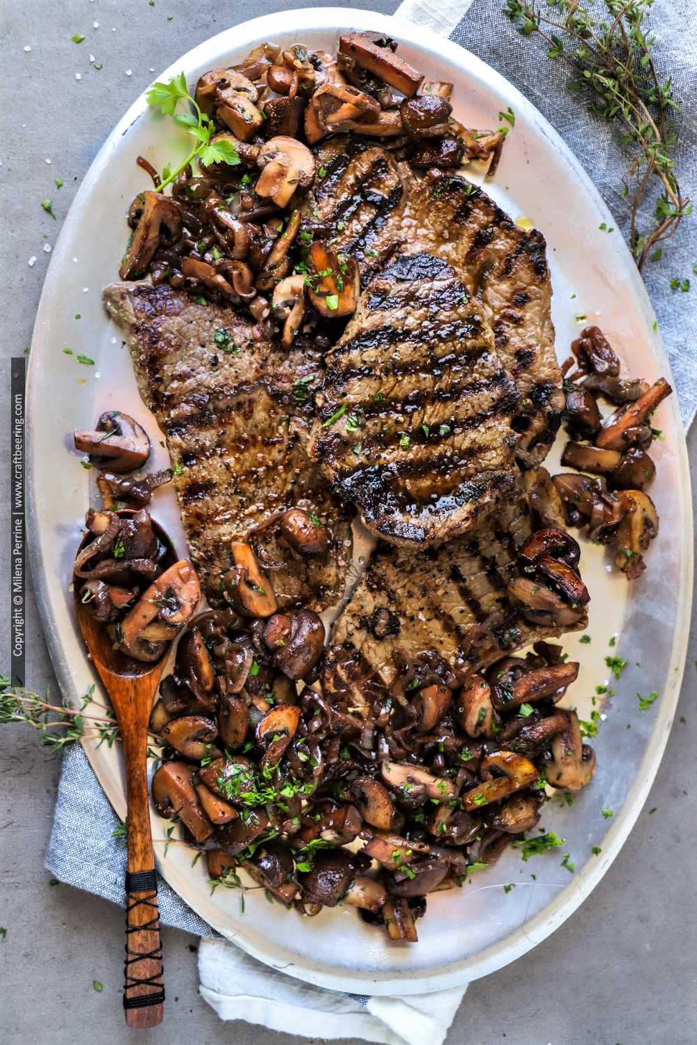 Steak with sauteed mushrooms and onions.