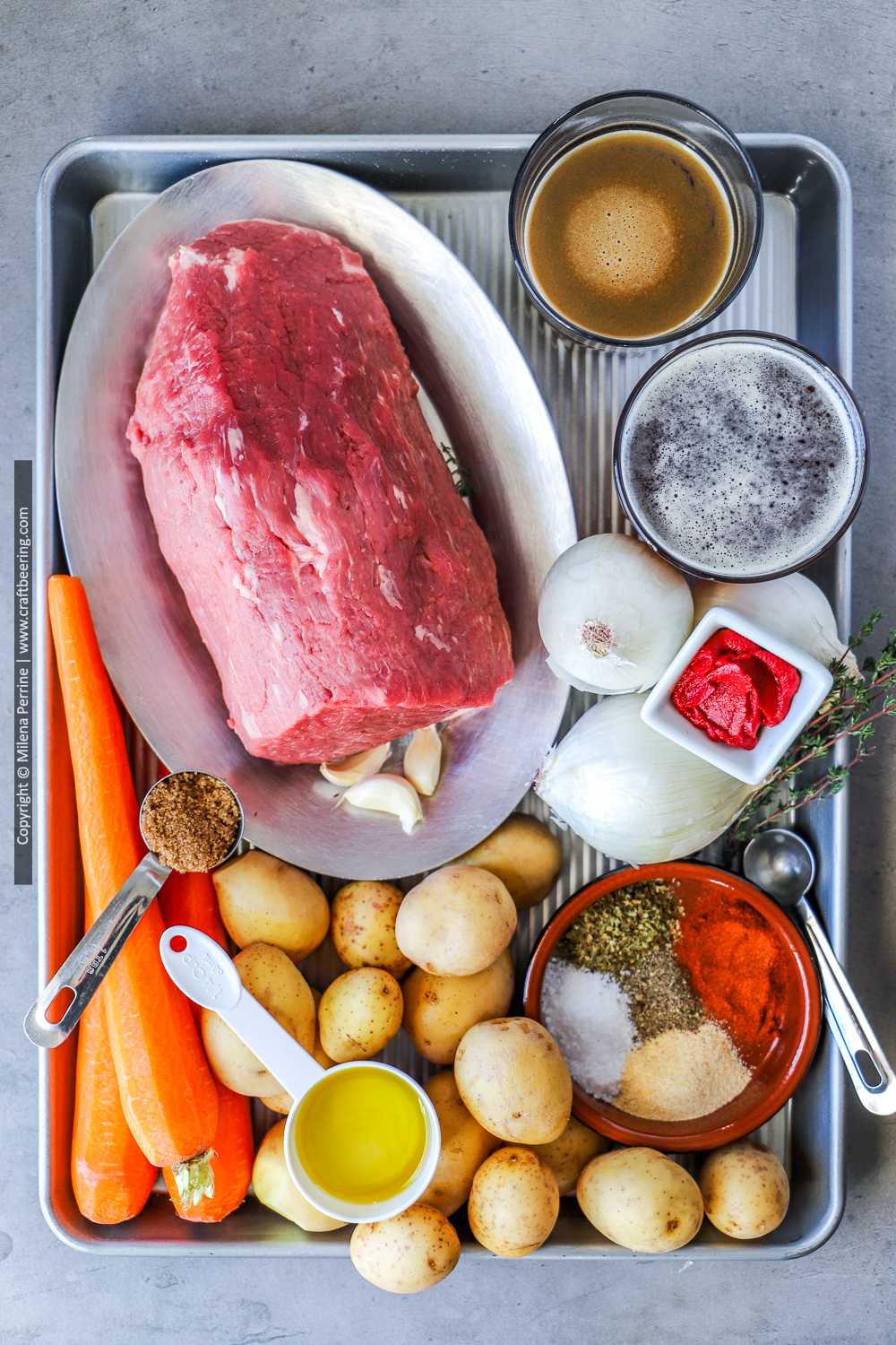 Raw eye of round with other ingredients for beef roast with vegetables.