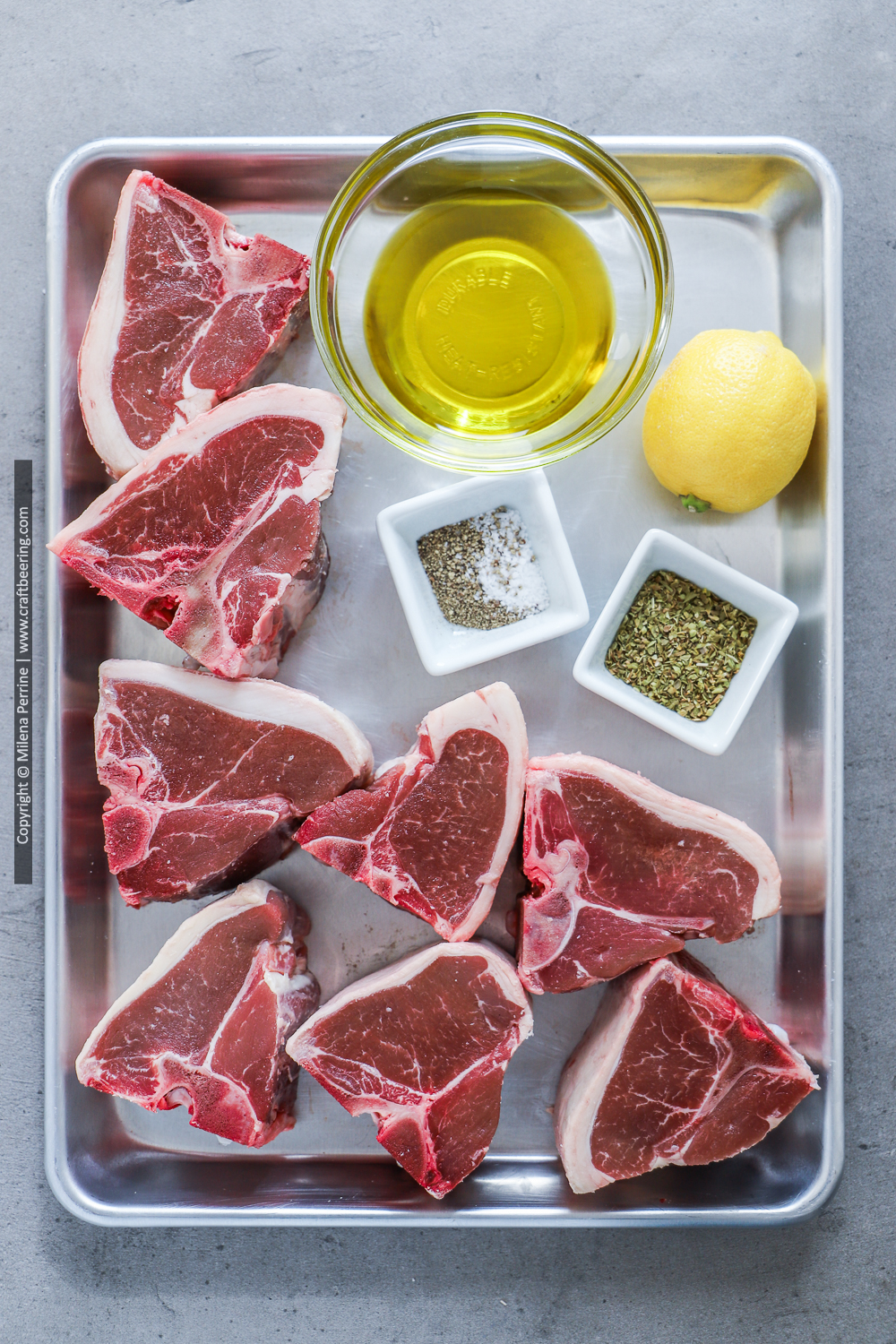 Raw loin lamb chops (lamb T-bones) and ingredients for marinade