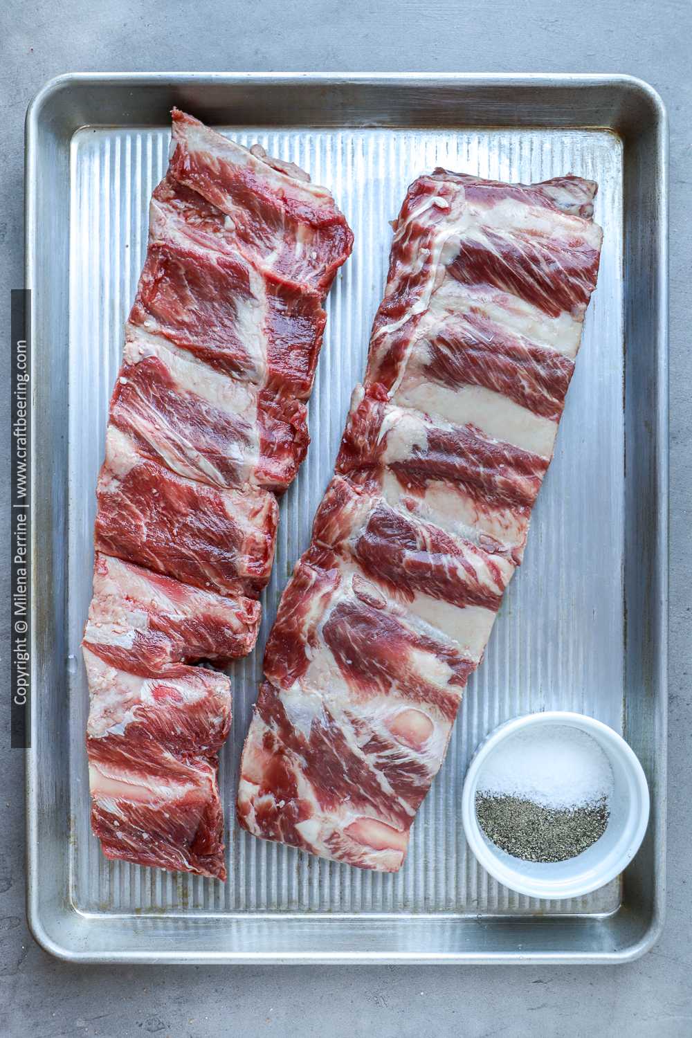 Raw beef back ribs. Two racks shown with meaty side up.