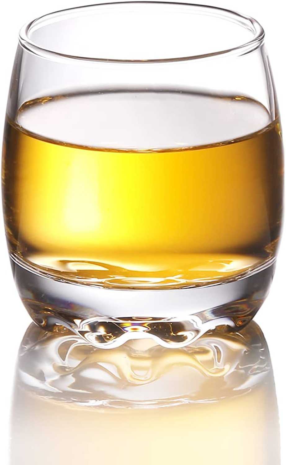 Rounded shot glass with whiskey