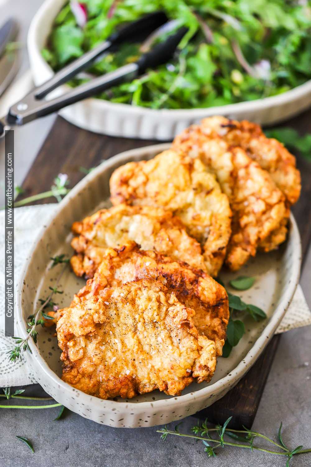 Country fried pork chops with crispy breaded coating. 