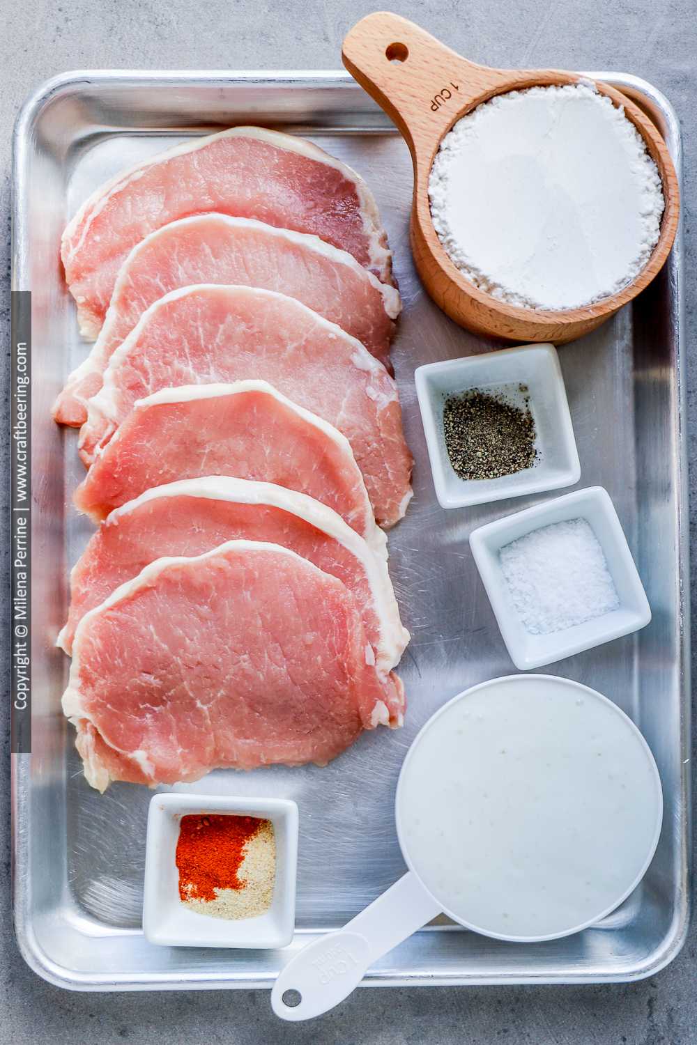Boneless pork loin chops and other ingredients for Southern fried pork chops.