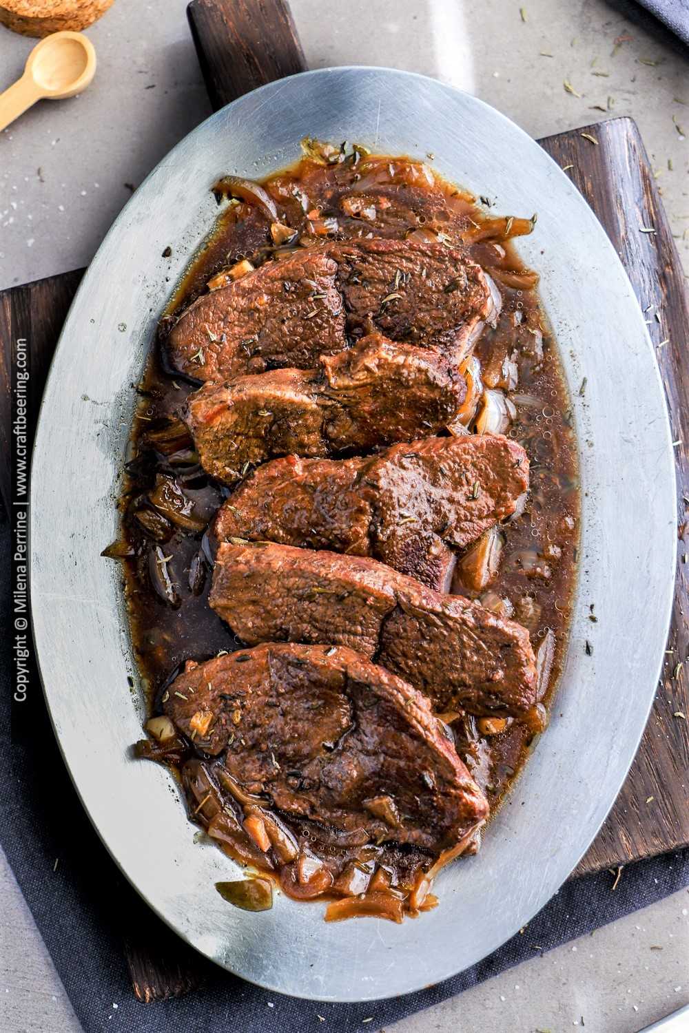 Mock tender steak braised to tenderness with red wine and onions