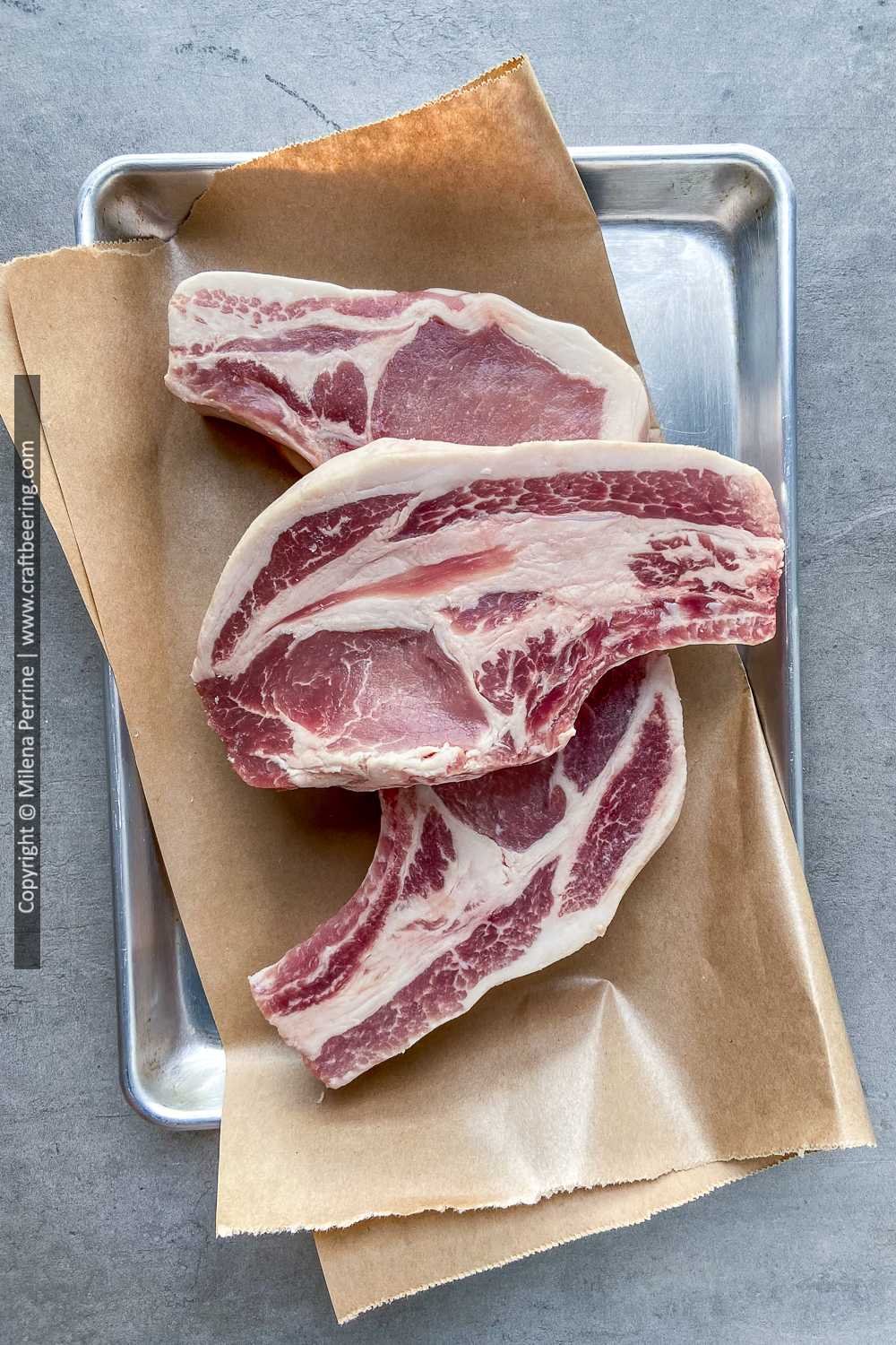 Raw thick bone-in pork chops are perfect for smoked bone in pork chops.
