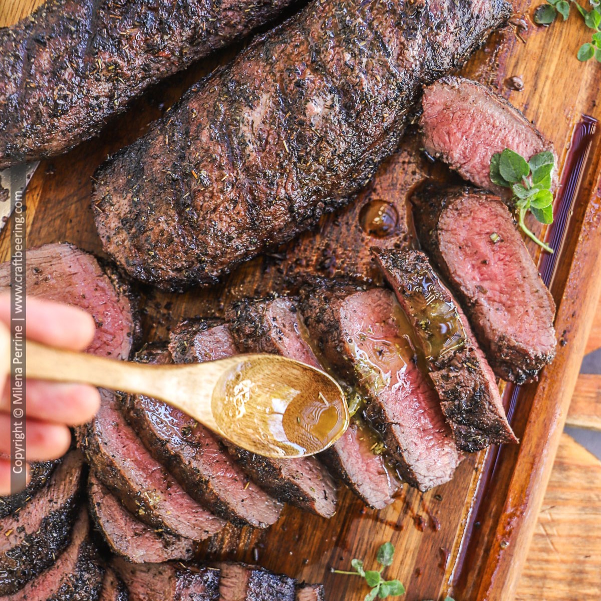 Whole grilled lamb loin is shown next to a sliced lamb loin that is being drizzled with sauce.