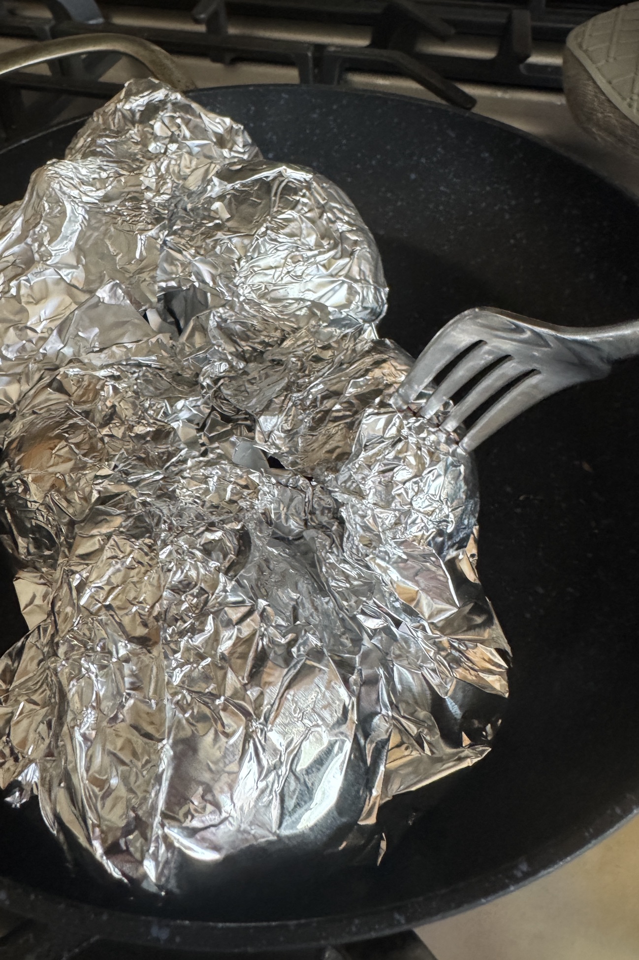 Probing beetroot tenderness with a fork.