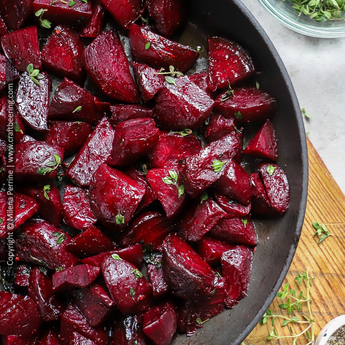 Roasted beets in foil are shown cut in wedges and lightly seared in a pan.