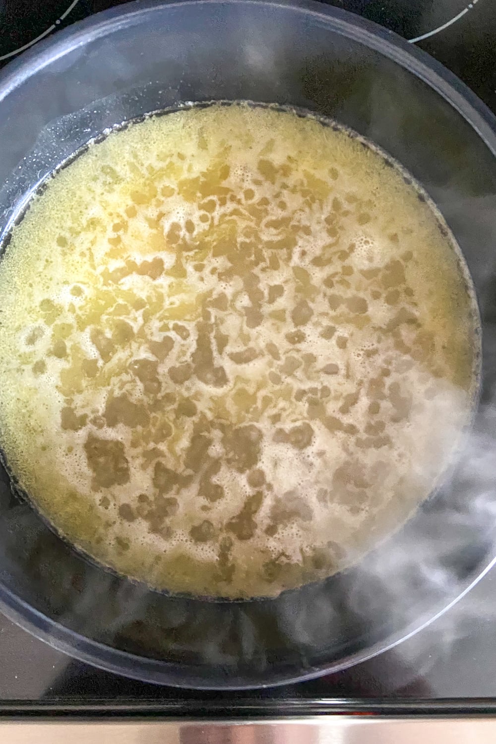 Liquid base for steaming couscous with butter boiling.
