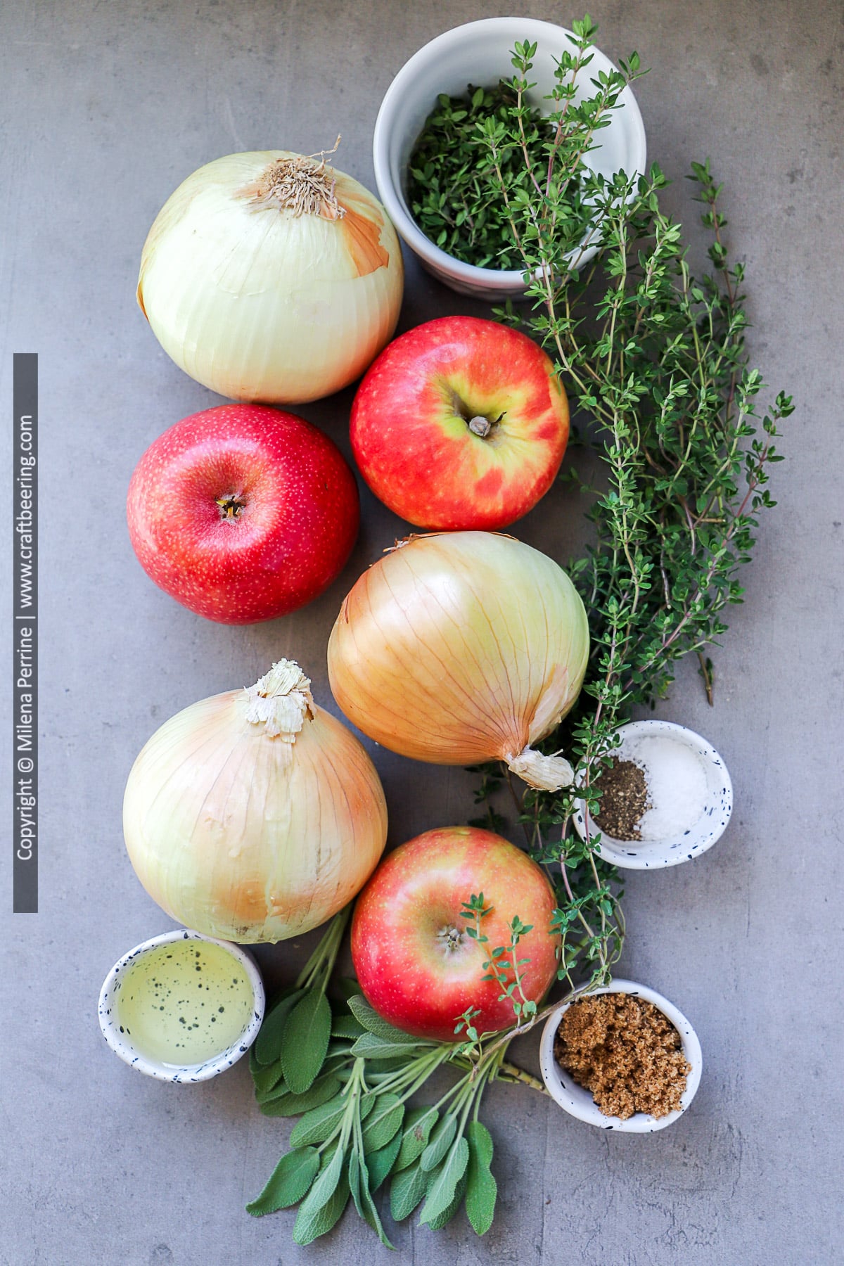 Ingredients for sheet pan baked or fried apples and onions - Pink Lady apples and yellow onions, fresh thyme, brown sugar, olive oil, sage, salt and pepper.